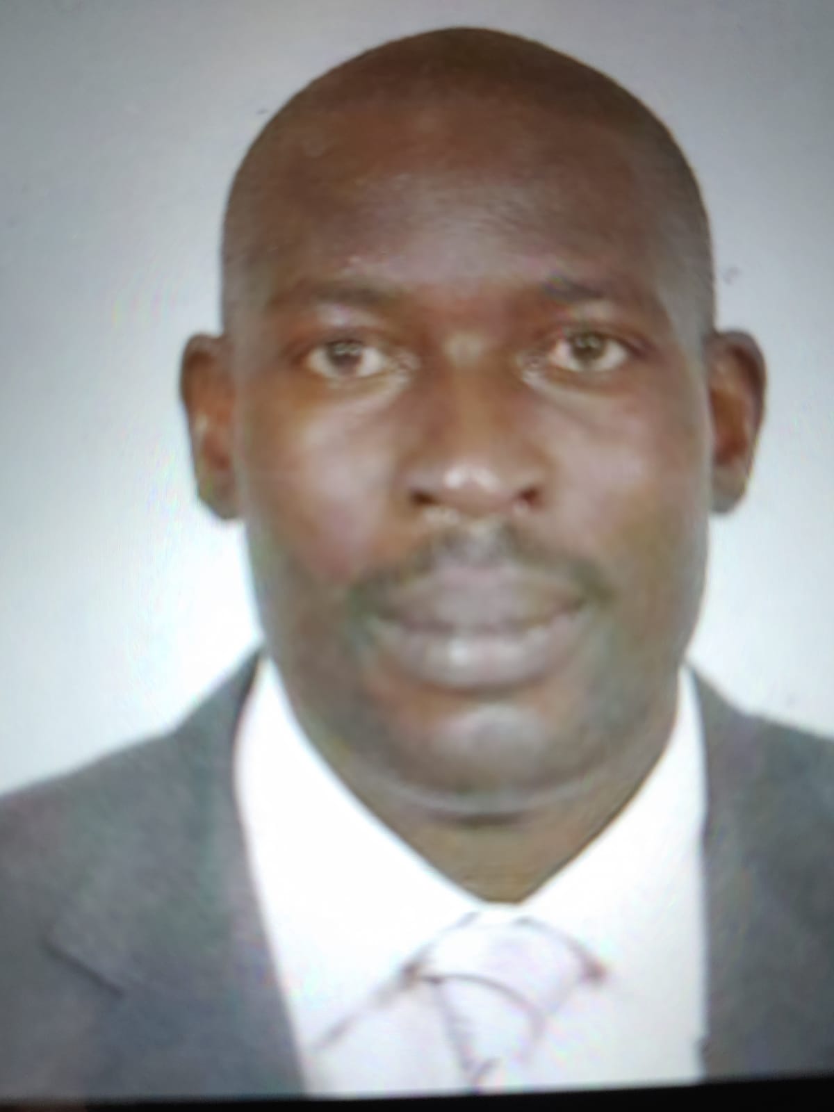 An image of a man in a suit and tie.